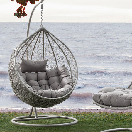 Poltrona a dondolo sospesa "Amirantes" per giardino e veranda in rattan con cuscino