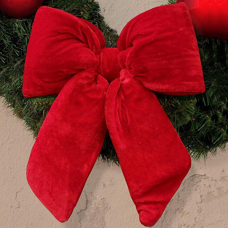 Fiocco in velluto imbottito decorazione natalizia per albero e ghirlanda dietro porta