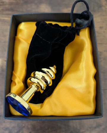 Plug Anale LoveToy metallo pesante color oro con pietra blu in confezione regalo