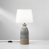 La lampada da tavolo unisce eleganza e design contemporaneo grigio e tortora 25X49cm
