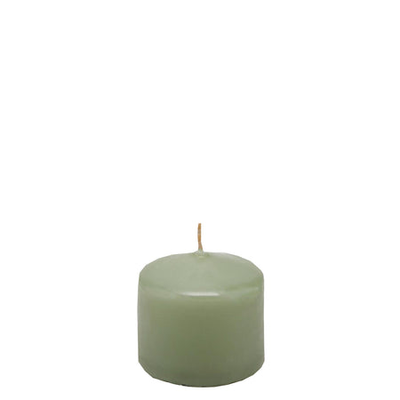 Candela classica in cera decorazione luminosa per ambienti color salvia