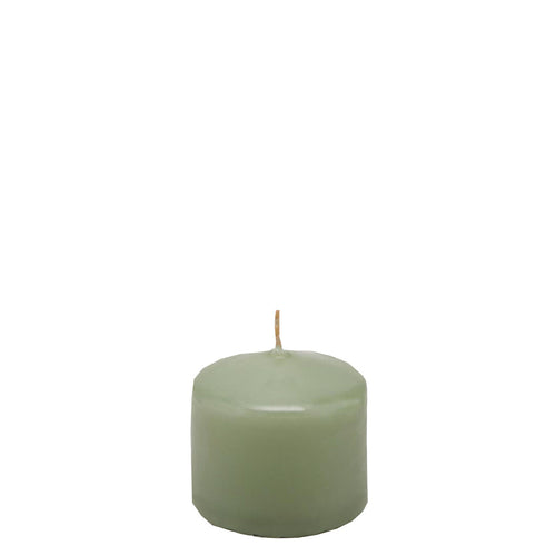 Candela classica in cera decorazione luminosa per ambienti color salvia