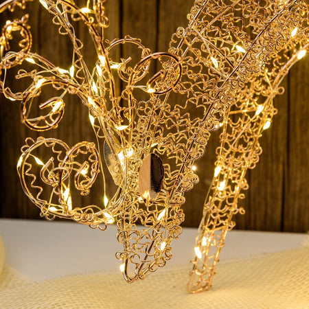 Renna tridimensionale luminosa "Renna che Bruca" decorazione in filo di rame con microled a luce calda