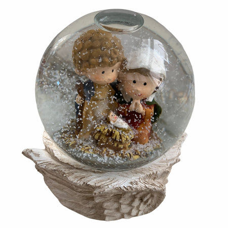 Sfera d'acqua Natività magica di cristallo con neve che cade e piedistallo