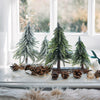 Alberelli di Natale innevati con base in legno in PE Effetto Real Touch h 23 cm