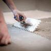 Frattone dentato con base in acciaio e manico in plastica 12 x 28 cm