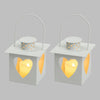 Set 2 lanterne e 2 candele a led con cuori traforati per decorazioni da interno.