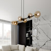 Lampadario Contemporaneo 6 Luci Rossi In Acciaio Nero E Sfere In Vetro Ambra