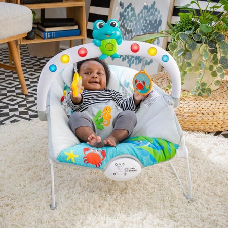 BABY EINSTEIN Sedia a sdraio Neptune - Ocean Explorers, 15 melodie, luci, vibrazioni