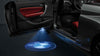 KIT LUCI LED LOGO PROIETTORE PORTIERA BMW BATTERIA SENSORE MAGNETE UNIVER