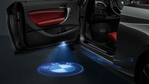 KIT LUCI LED LOGO PROIETTORE PORTIERA BMW BATTERIA SENSORE MAGNETE UNIVER