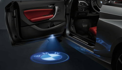 KIT LUCI LED LOGO PROIETTORE PORTIERA BMW BATTERIA SENSORE MAGNETE UNIVER