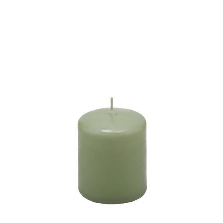 Candela classica in cera decorazione luminosa per ambienti color salvia