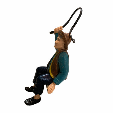 Statuetta per presepe natalizio uomo seduto con una frusta lucida h10 cm