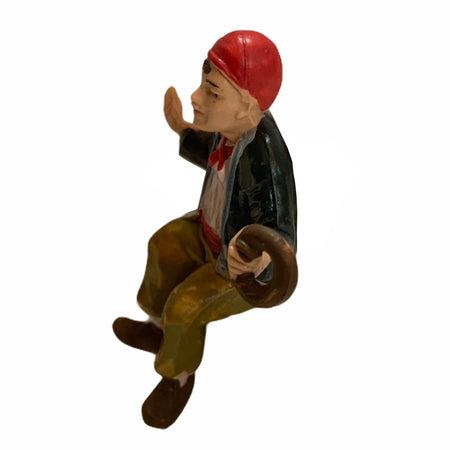 Statuetta per presepe natalizio uomo seduto con una ciambella h 7 cm