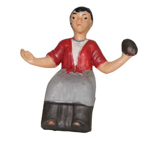 Statuetta Donna seduta con pane per presepe natalizio da 7 cm