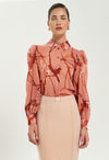 Blusa Artigli fantasia con bottoni.