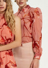 Blusa Artigli fantasia con bottoni.