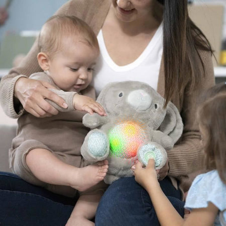 INGENUITY Sylvi, peluche a forma di coniglietto, melodie e vibrazioni rilassanti, luminoso, regalo di nascita