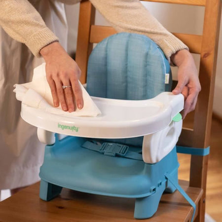Seggiolino rialzato pieghevole Deluxe INGENUITY Turchese, portatile con vassoio e cinghie incluse