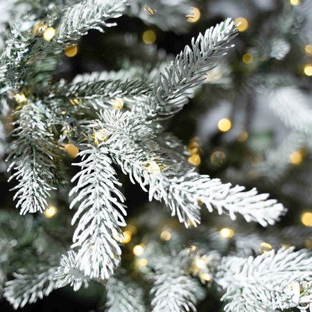 Albero di Natale innevato "Nikolai" con Micro led in PE Effetto Real Touch + PVC + Flock