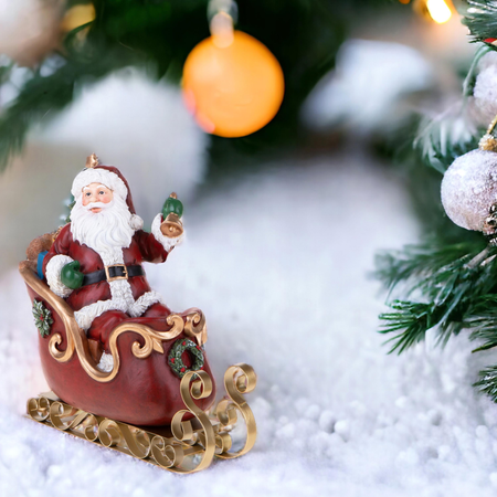 Statuetta babbo natale su slitta in resina per decorazioni natalizie