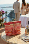 Pochette fantasia con filo strass e nappine | PHO Firenze