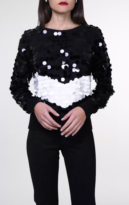 Pull girocollo con macropailettes