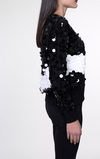 Pull girocollo con macropailettes