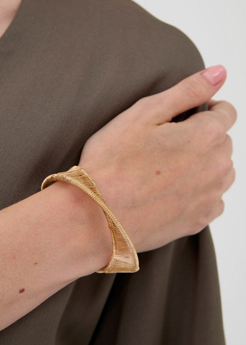 Bracciale sinuoso regolabile oro