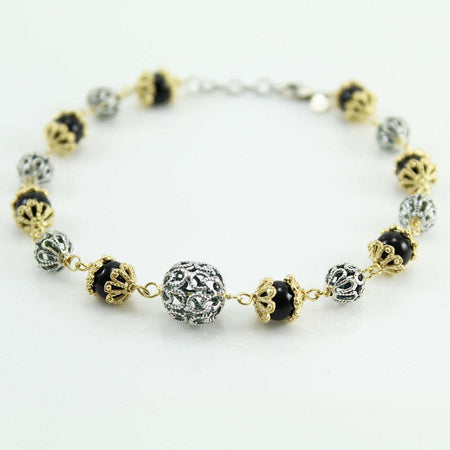 Bracciale donna argento bicolore con sfere filigrana traforate e onice su coccu