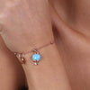 BYSIMON----Bracciale-in-Metallo-con-campanella-portafortuna-pendente,-impreziosita-da-smalto-turchese-e-punto-luce