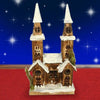 Casetta-Legno-Innevata-Luminosa-Con-2-Torri-Altezza-40-Cm-Decorazioni-Natalizie