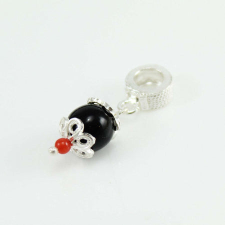 Charm pendente in argento su coccu con corallino Filu & Trama