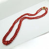 Collana donna lunga doppio filo corallo rosso e chiusura fiore in oro giallo