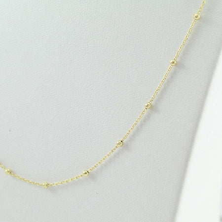 Collana girocollo donna in oro giallo con sfere lucide sfaccettate intercalari