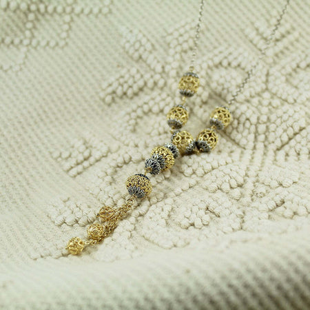 Collana lunga da donna in argento sfere filigrana sarda traforate dorate e brunite