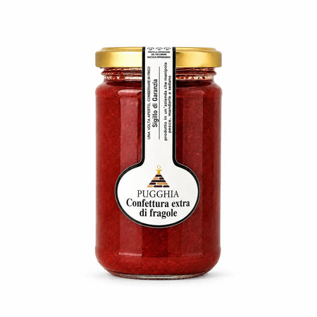 Un barattolo di vetro di confettura extra di fragole pugglia con coperchio dorato ed etichetta bianca da 300 gr