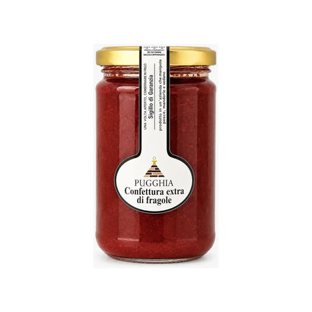 Un barattolo di vetro con coperchio dorato contiene confettura extra di fragole pugghia da 300 gr con etichetta bianca
