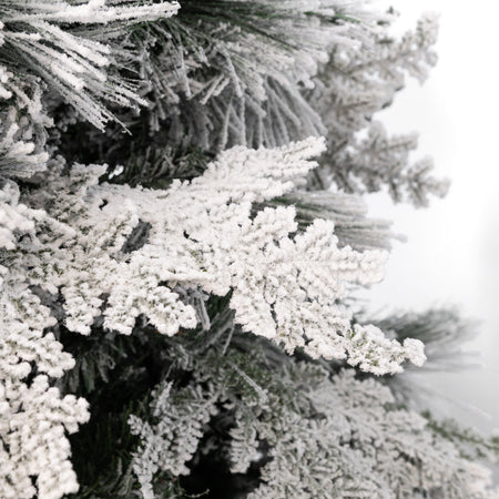 Albero di natale innevato con Pigne "Crans Montana" in  PE Effetto Real Touch + PP Effetto Aghi di Pino