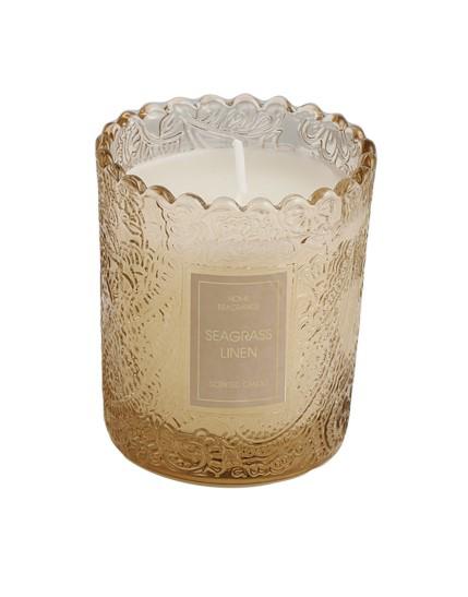 Candela profumata piccola in barattolo di vetro ambra, firmata Special Gifts, altezza 7 cm, diametro 6 cm, completa di scatola regalo elegante.