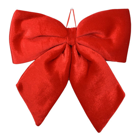 Fiocco rosso in velluto imbottito decorazione natalizia per albero e ghirlanda dietro porta