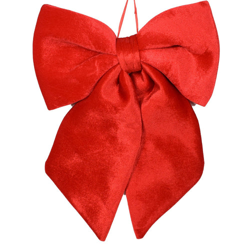 Fiocco rosso in velluto imbottito decorazione natalizia per albero e ghirlanda dietro porta