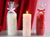 Candela colorata con superficie a cuori in rilievo 17 cm
