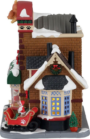 Le zampe di Babbo Natale, edificio illuminato per villaggio di Natale in porcellana Casa e cucina/Decorazioni per interni/Addobbi e decorazioni per ricorrenze/Decorazioni natalizie/Oggettistica MagiediNatale.it - Altamura, Commerciovirtuoso.it