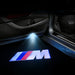 KIT LUCI LED LOGO PROIETTORE PORTIERA BMW MSPORT BATTERIA SENSORE MAGNETE UNIVERSALE