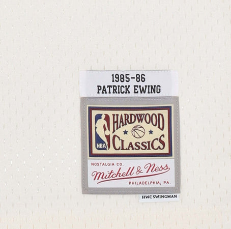 MITCHELL-&amp;-NESS-Canotta-Basket-Uomo-Nba-Off-White-Team-Color-Swingman-Jersey-Hardwood-Classics-1985-No-33-Patrick-Ewing-Neykni-Off-White-da-uomo