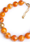 MYA-ACCESSORIES-|-Collana-girocollo-con-sfere-dalle-nuances-arancio