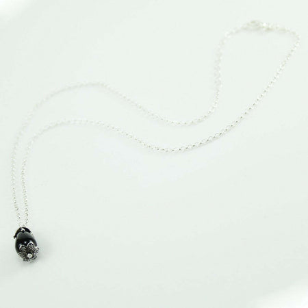 Parure donna collana e orecchini in argento su coccu con pietra onice a goccia