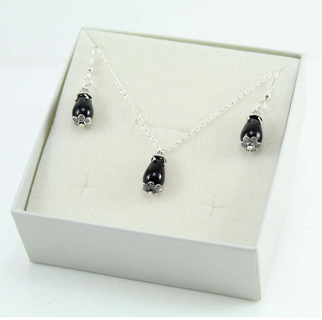 Parure donna collana e orecchini in argento su coccu con pietra onice a goccia